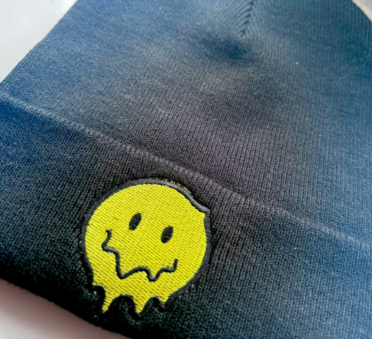 Melting Smiley Face Embroidered Cuffed Beanie Hat