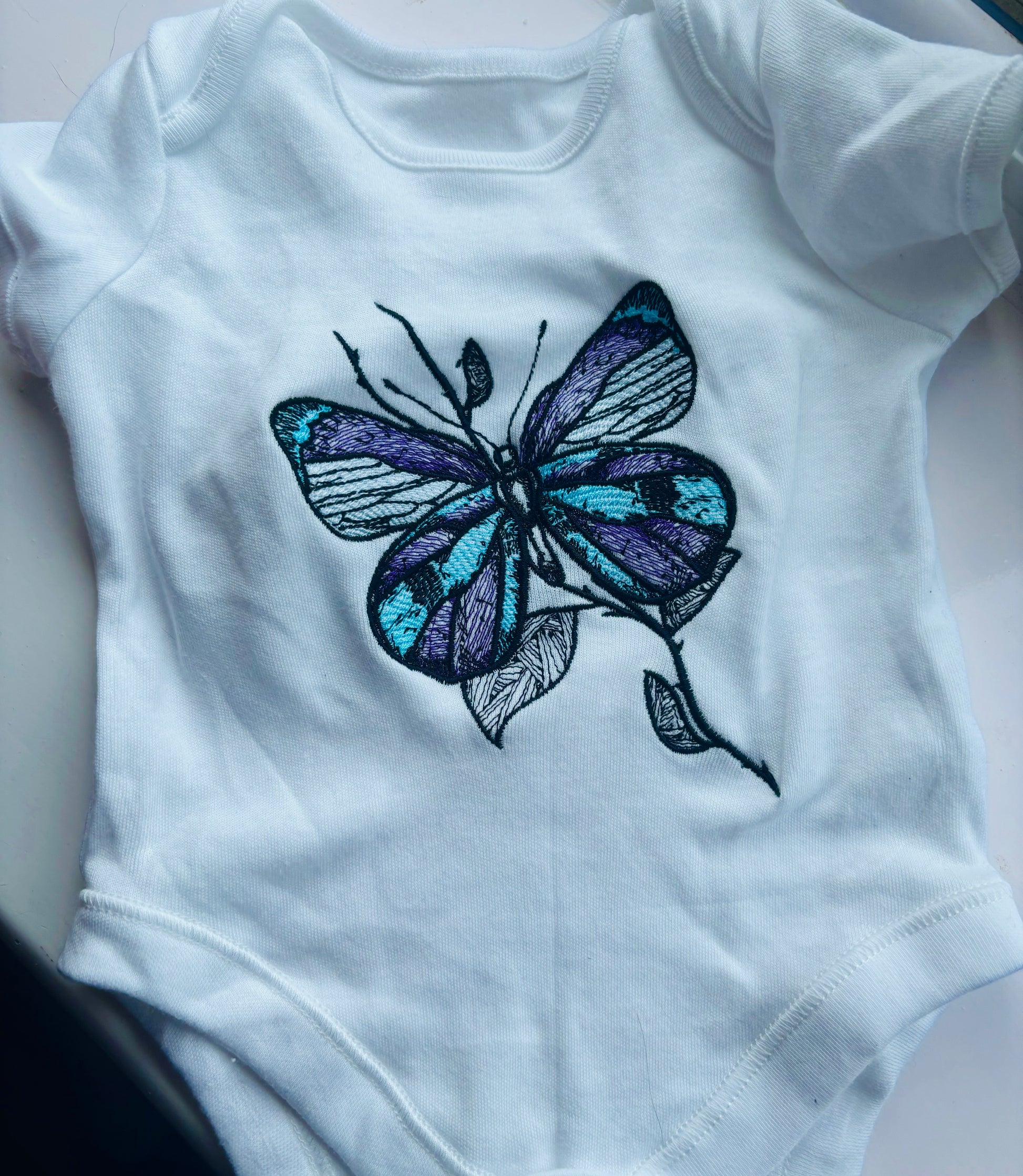 Embroidered baby grow 